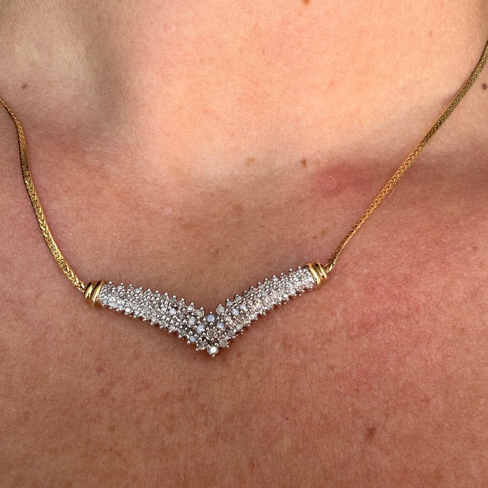 Diamond and gold chevron necklace.